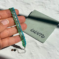 Pulsera Ami (tejido)